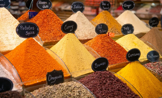 Spices are displayed in a market stall.